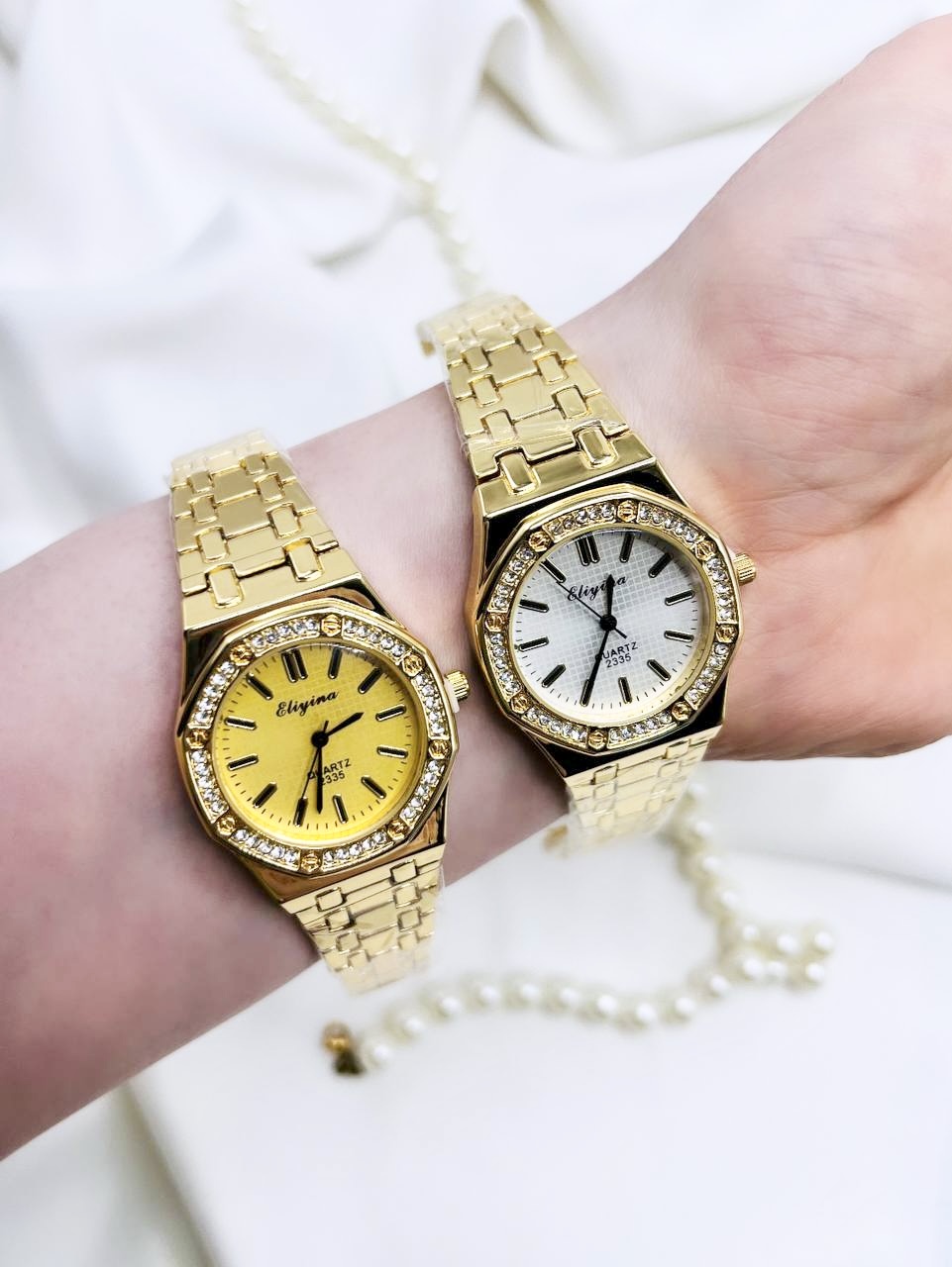 ساعت مچی زنانه طلایی الینا با صفحه زرد و سفید کوارتز